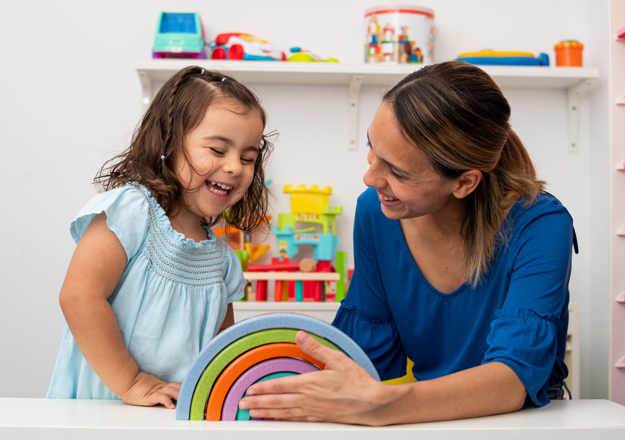 Two-year-old,Girl,And,Her,Young,Kindergarten,Teacher,,Both,Caucasian,,Play Kindergarten teacher and child playing with rainbow blocks