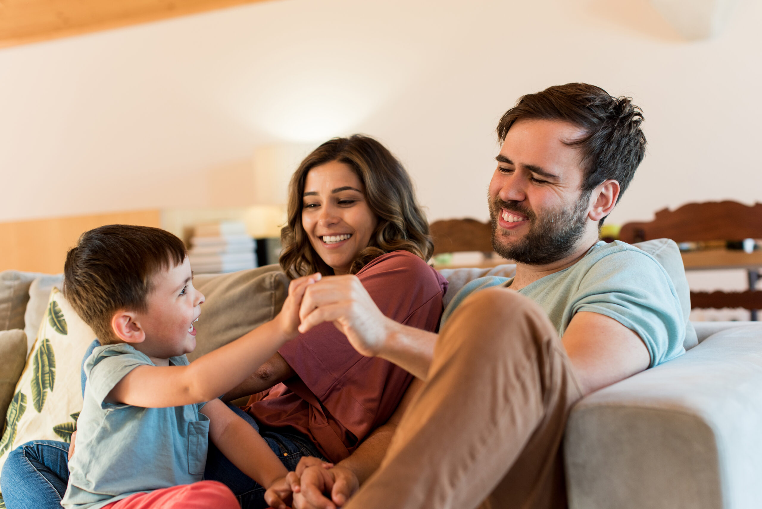 Family,Playing,At,Home.,Happy,Couple,And,Little,Boy