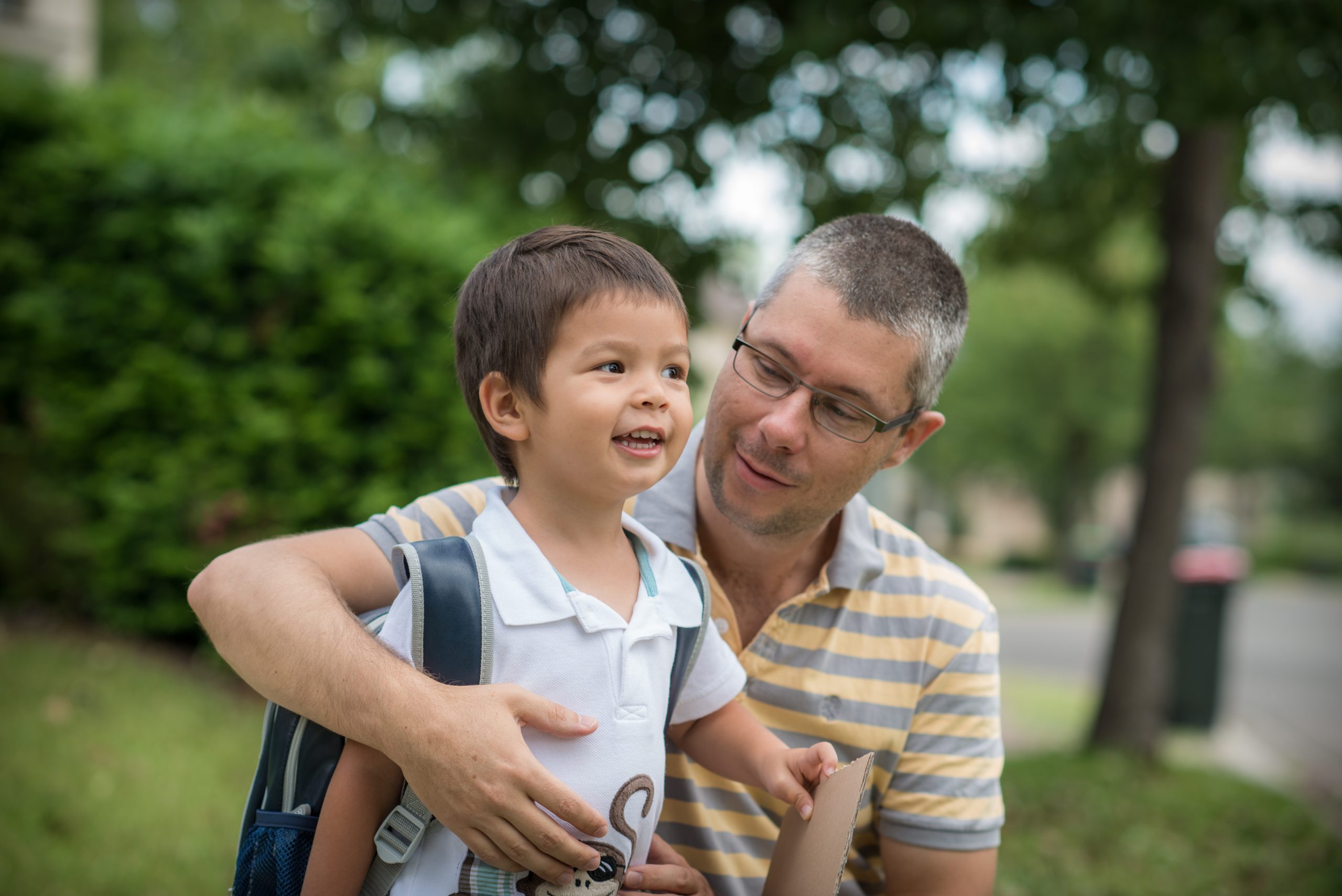 Young boy with dad starting kindergarten