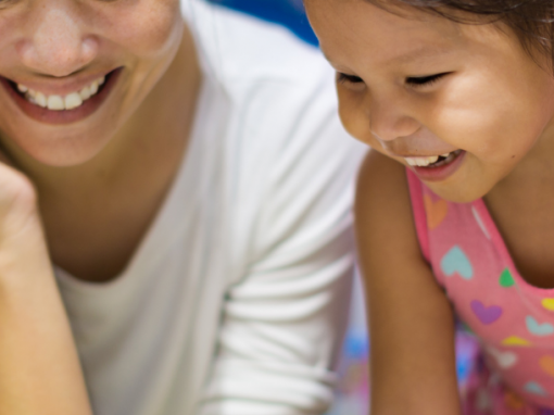 Kindergarten teacher with young girl