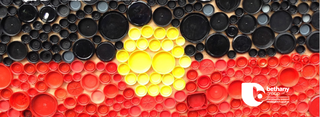 Photograph of the Aboriginal Flag, presented as coloured bottle lids